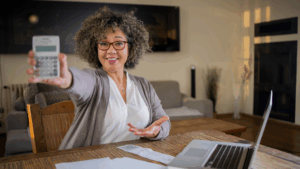 Taxpayer calculating finances while preparing to file taxes with outstanding IRS debt