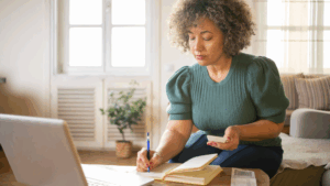 Taxpayer reviewing tax documents while filing a return with existing IRS debt