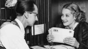 Client meeting with a tax relief advisor while holding unopened IRS letters related to back taxes and notices.