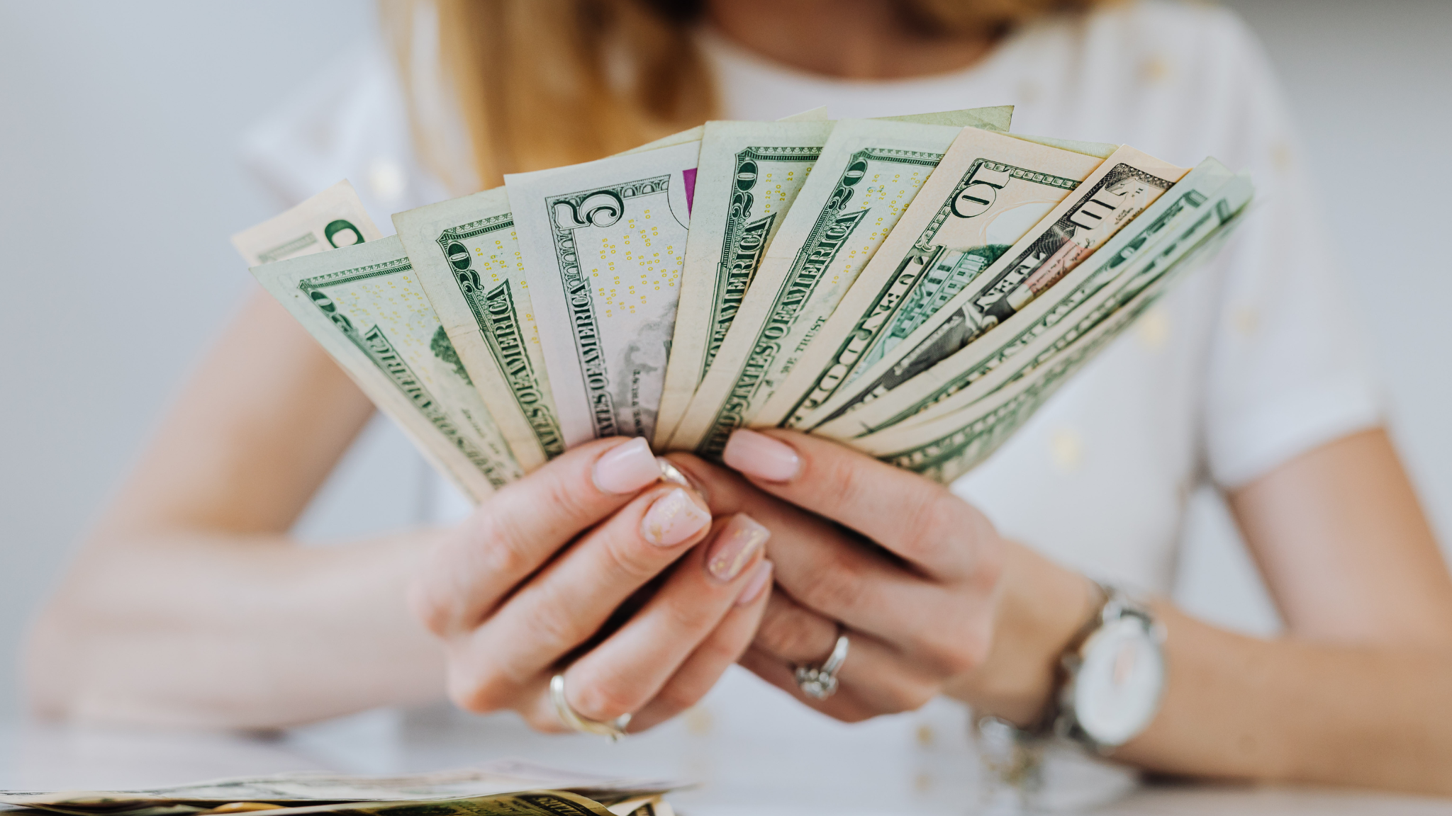 Taxpayer holding money and reviewing IRS payment plan options for unpaid tax debt