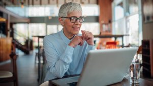 Woman researching tax relief eligibility on her laptop.
